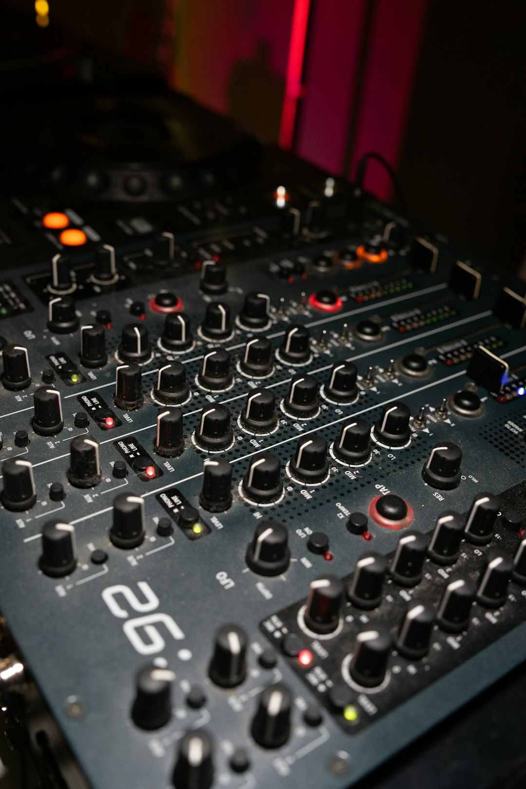 close-up-of-a-dj-mixer-with-many-knobs-icpxcmawog8