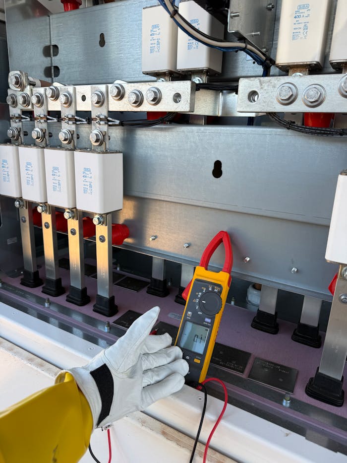 technician-measuring-electrical-panel-voltage-outdoors-35138694 technician-measuring-electrical-panel-voltage-outdoors-35138694